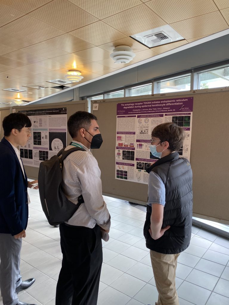 Christopher Johnson at poster symposium